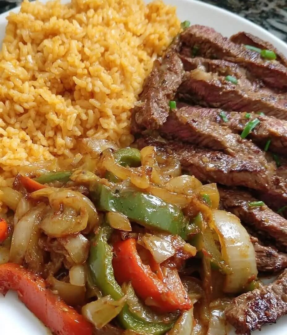 🥩🫑🧅🍚 Steak with Peppers, Onions, and Yellow Rice IMG_3338